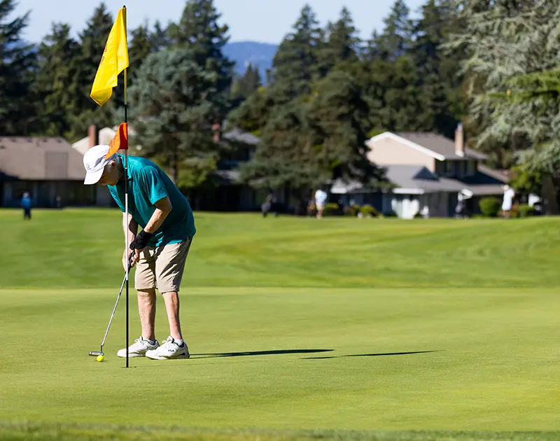 man golfing at summerfield retirement community golf course in tigard, oregon