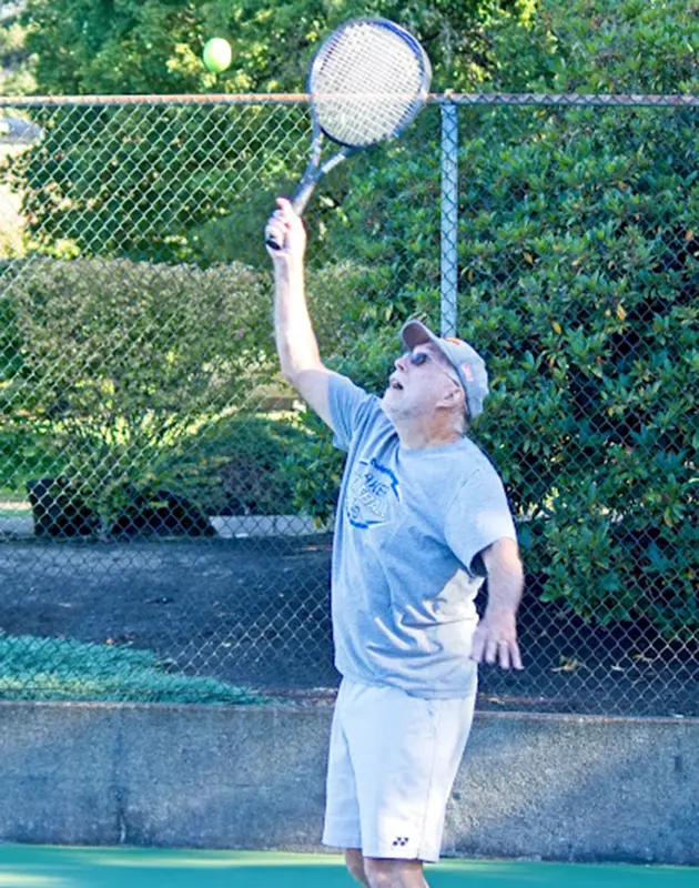 senior playing tennis at summerfield retirement community in Tigard, Oregon